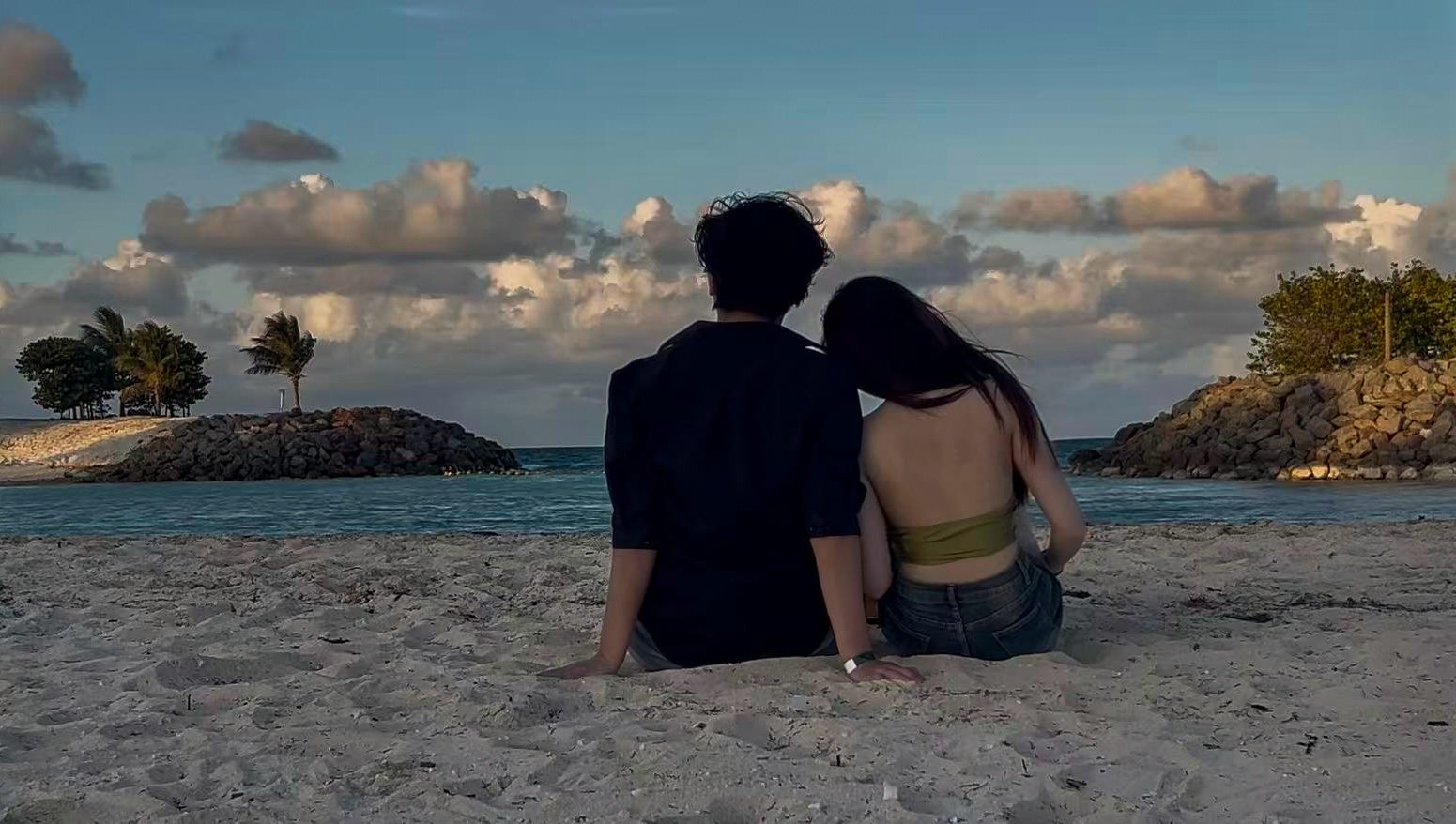 Couple watching the sunset together on Ocean Cay