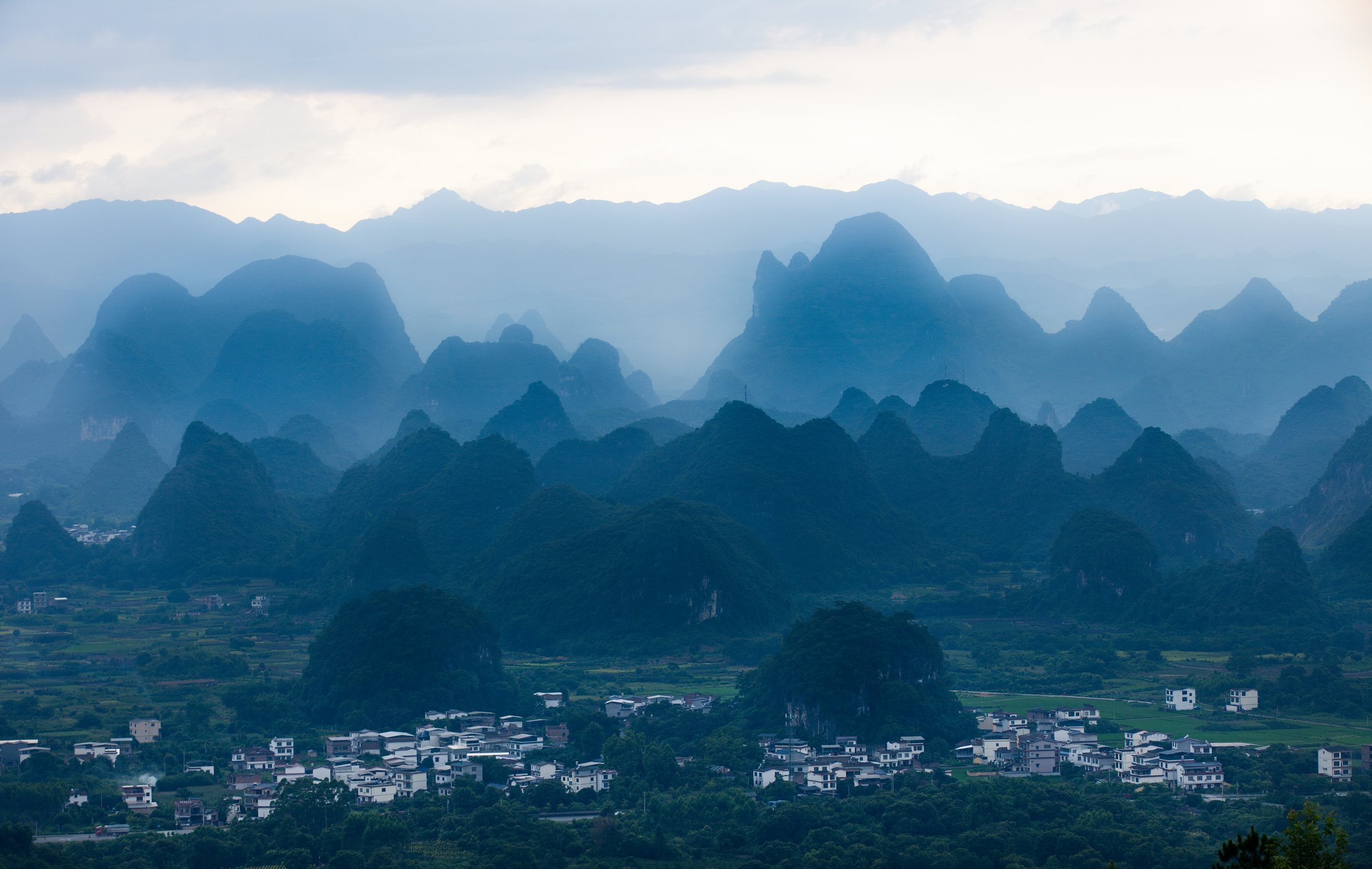 Blue mist over Guilin's karst mountain villages