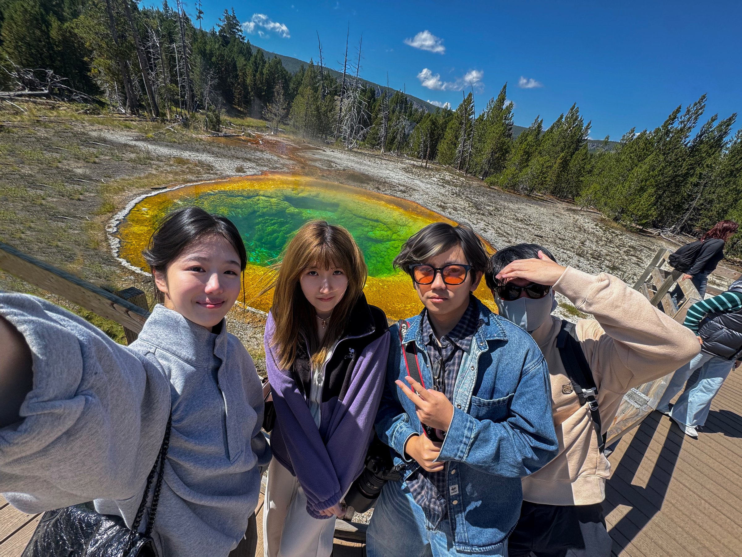 Friends together at a Yellowstone hot spring
